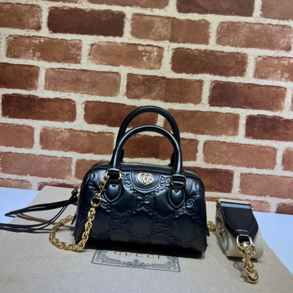 G*u*i gg matelassé leather top handle bag