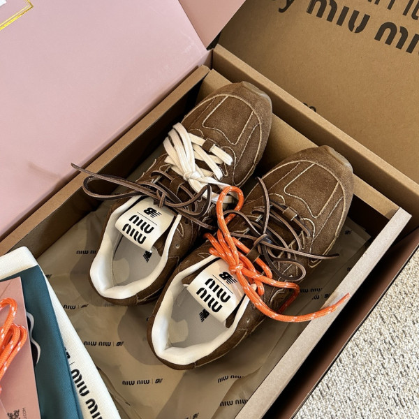 M*um*u x new balance sneaker