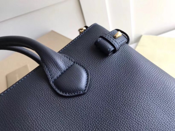 B**rry the medium banner in leather and house check