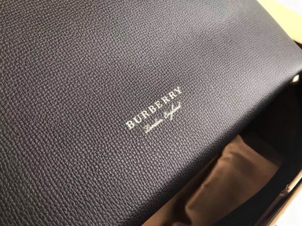 B**rry the medium banner in leather and house check