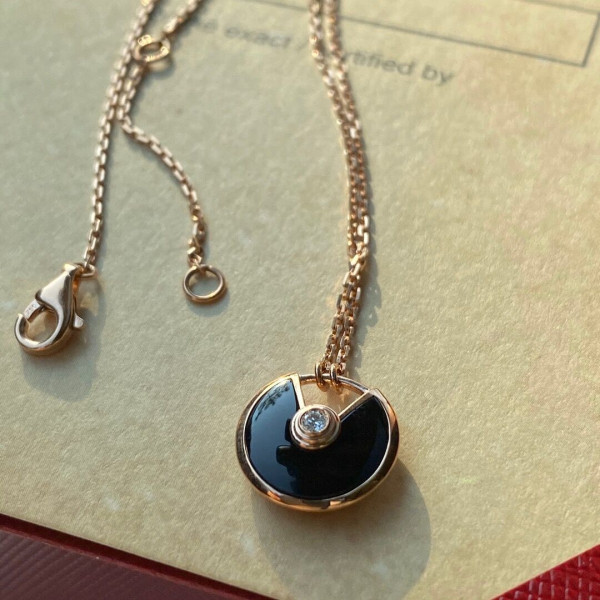 Ca*t*er amulet necklace