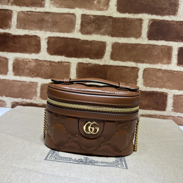 G*u*i gg matelassé top handle mini bag